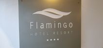 "entrance sign of Flamingo Hotel Resort"